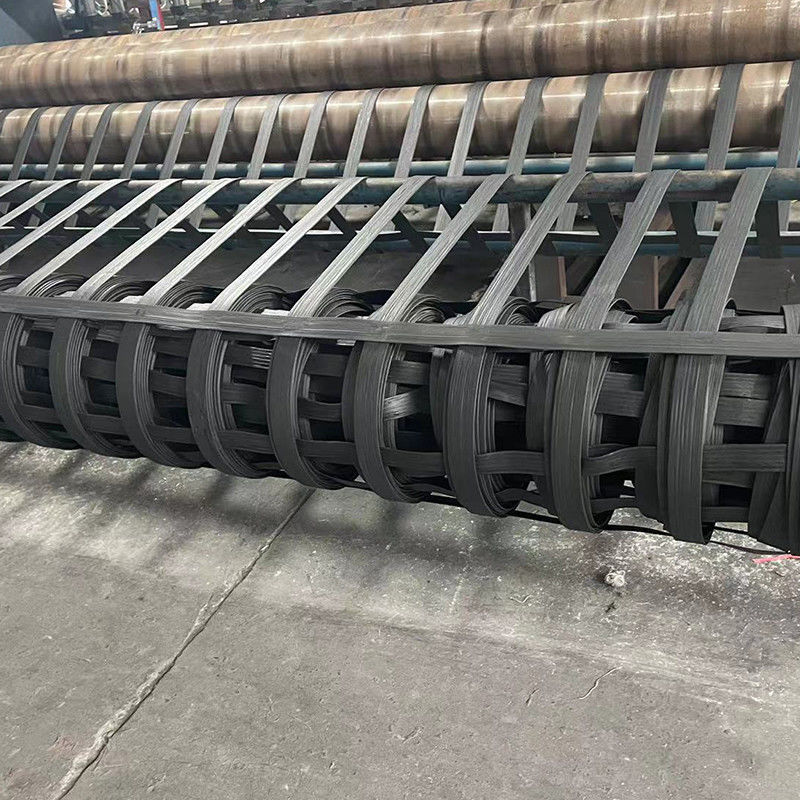 Rejilla geográfica de plástico reforzada con fibra de alta resistencia de poliéster bixial para la construcción de carreteras