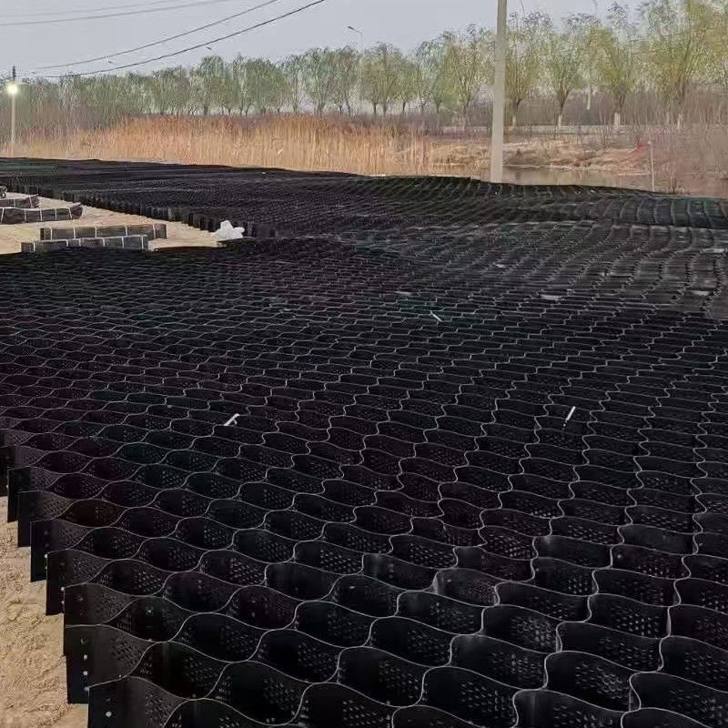 Rejilla de grava de geocelulas HDPE texturizada y perforada de plástico de panal de miel para estabilización de la construcción de carreteras
