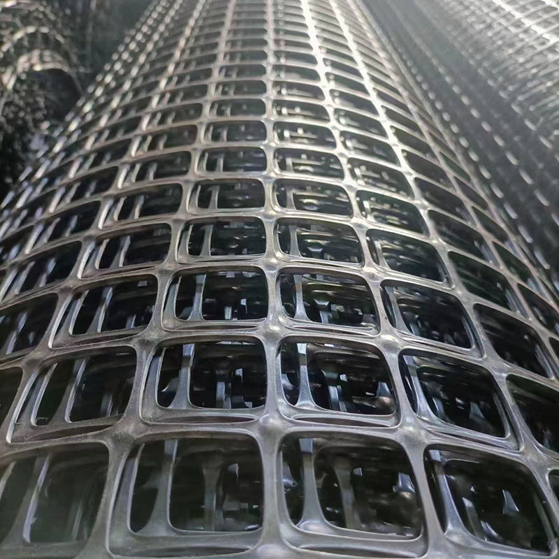 Alta resistencia a la tracción malla de plástico biaxial 30kN/m Negro PP/PET Geogrid para el refuerzo del suelo y la estabilización de la base de la carretera