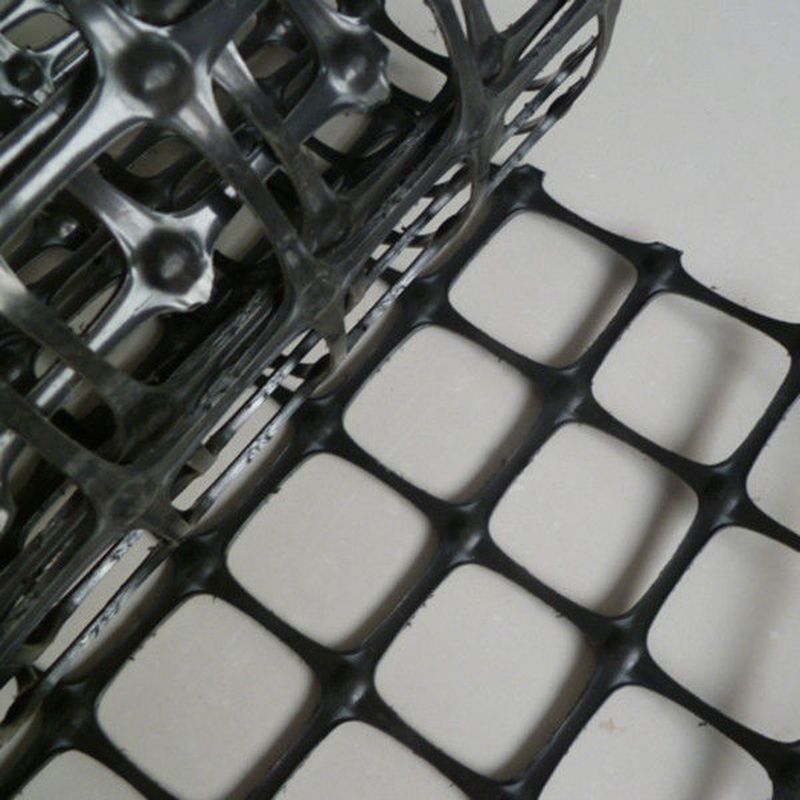 Alta resistencia a la tracción malla de plástico biaxial 30kN/m Negro PP/PET Geogrid para el refuerzo del suelo y la estabilización de la base de la carretera