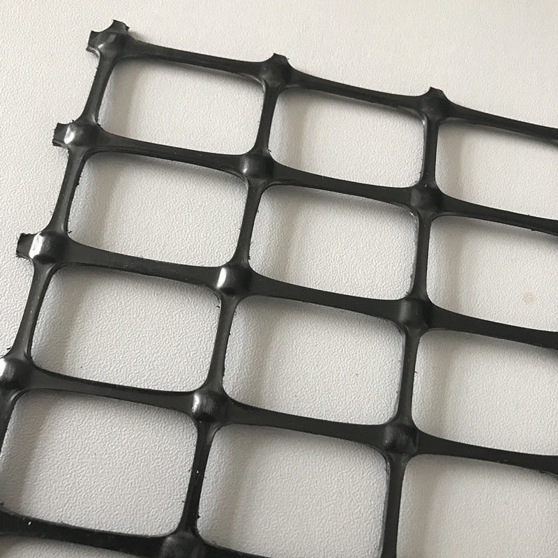Alta resistencia a la tracción malla de plástico biaxial 30kN/m Negro PP/PET Geogrid para el refuerzo del suelo y la estabilización de la base de la carretera